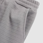 Men's solid color textured elastic waist shorts