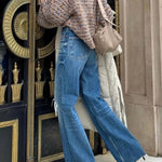 Brown and blue heathered chunky knitted turtleneck and flared sleeve sweater