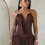 Gioia dress. Timeless elegance encapsulated in a fluid and sensual silhouette. This draped jumpsuit is designed for the woman who knows how to effortlessly command attention.