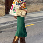 White denim overshirt embroidered with bright colors and pockets
