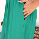 Solid color halter neck open back flared jumpsuit