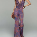 Retro-print Jumpsuit With Ruffled Neckline And Flared Legs