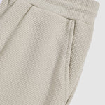 Men's Solid Color Textured Puff Grid Elastic Waist Casual Pants