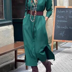 Satin shirt dress with a fitted waist and side slit.