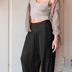 Loose wide leg trousers with leggings and sports trousers