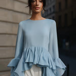 Elegant Sky Blue Peplum Blouse With Tiered Ruffle Hem And Flared Sleeves