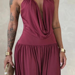 Gioia dress. Timeless elegance encapsulated in a fluid and sensual silhouette. This draped jumpsuit is designed for the woman who knows how to effortlessly command attention.