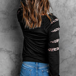 Black Leopard Peek-a-Boo Sleeve Skull Graphic Sweatshirt