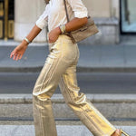 Retro straight-leg gold trousers with loose pockets and wide legs