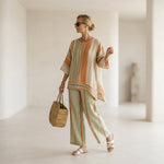 Elisabetta – elegant asymmetric top with wide-leg trousers