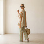 Elisabetta – elegant asymmetric top with wide-leg trousers