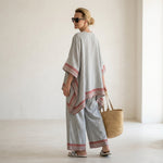 Rossella – Refined asymmetric blouse with wide-leg ethnic trousers