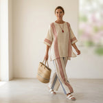 Ludovica – sophisticated multicolored striped top paired with Mediterranean trousers