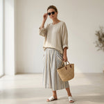 Aurora – comfortable blouse and striped midi skirt
