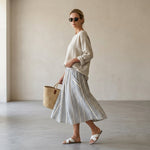 Aurora – comfortable blouse and striped midi skirt