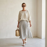 Aurora – comfortable blouse and striped midi skirt