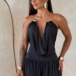 Gioia dress. Timeless elegance encapsulated in a fluid and sensual silhouette. This draped jumpsuit is designed for the woman who knows how to effortlessly command attention.