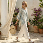 Annalisa – Comfortable printed blouse paired with long white trousers