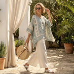 Annalisa – Comfortable printed blouse paired with long white trousers
