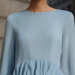 Elegant Sky Blue Peplum Blouse With Tiered Ruffle Hem And Flared Sleeves