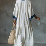 Loose And Cozy Patchwork Denim Dress With Contrasting Trim.