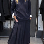 Women's Solid Color Stand-collar Long-sleeved Loose-fitting Knitted Top And High-waisted Loose A-line Skirt Set.